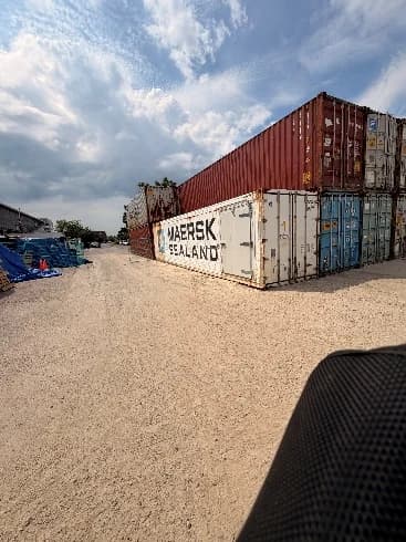 Shipping containers placed on a gravel yard