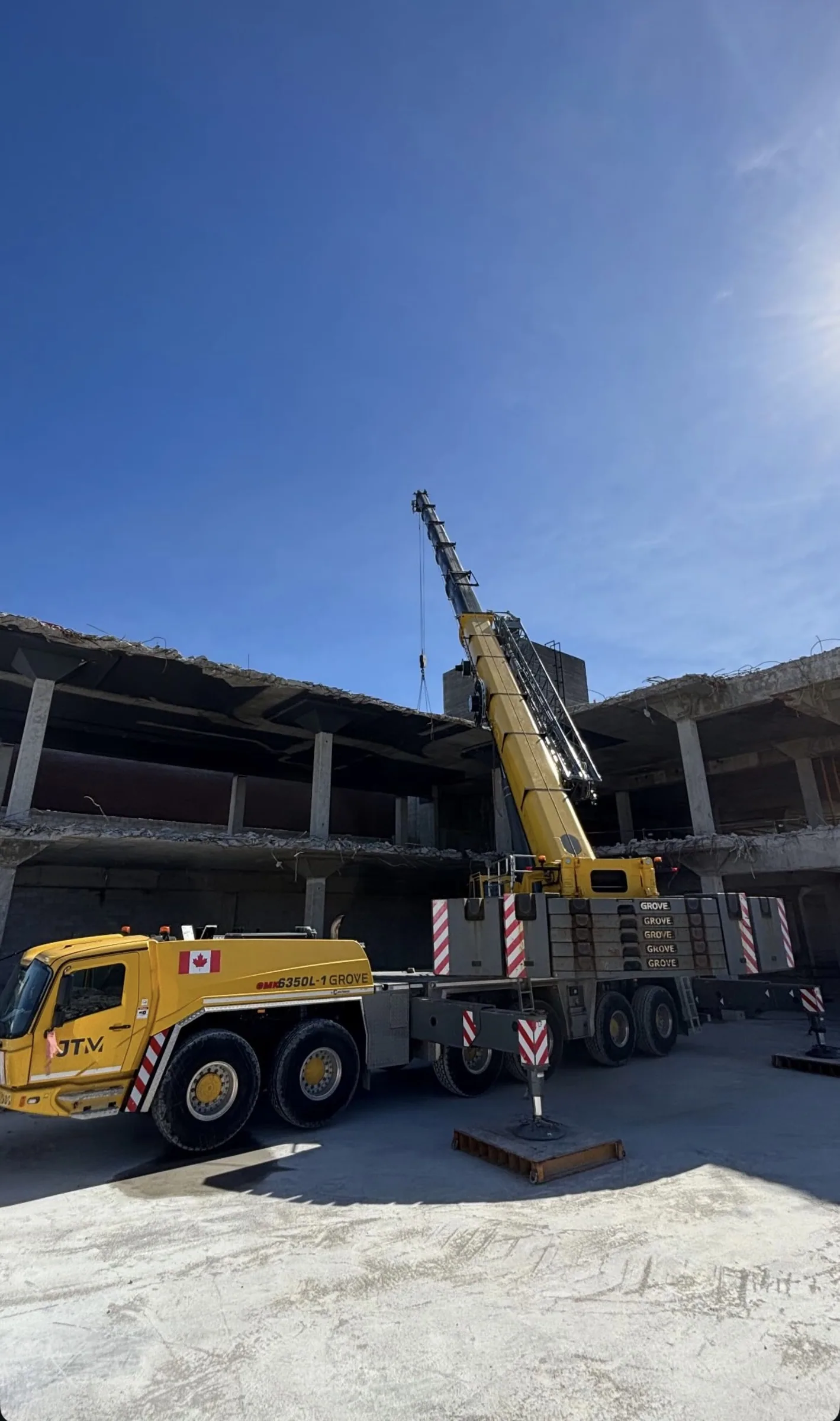 JTM Cranes machine set up on mats inside a partially demolished concrete structure