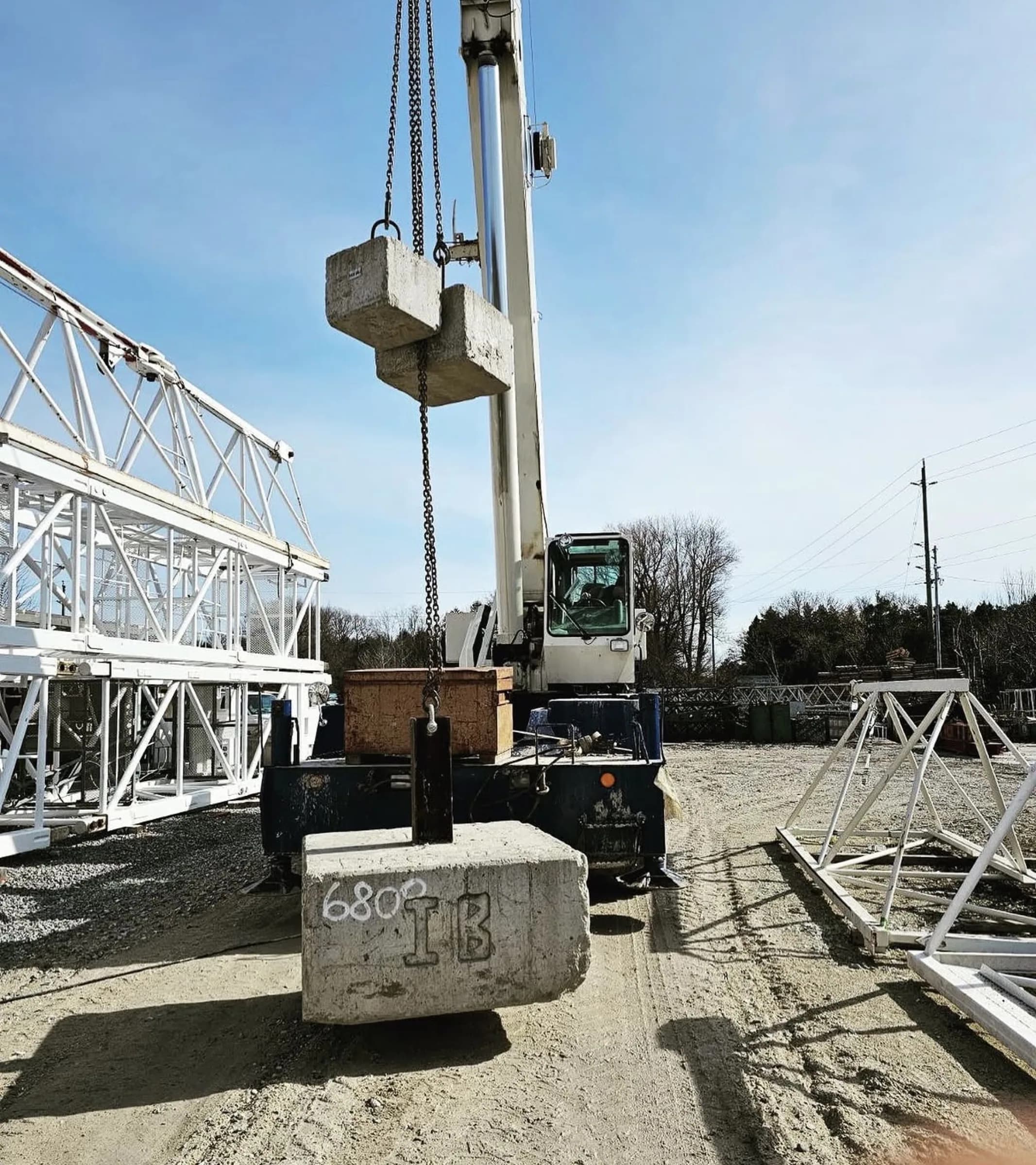 Counterweight being lifted into place during a tower crane assembly